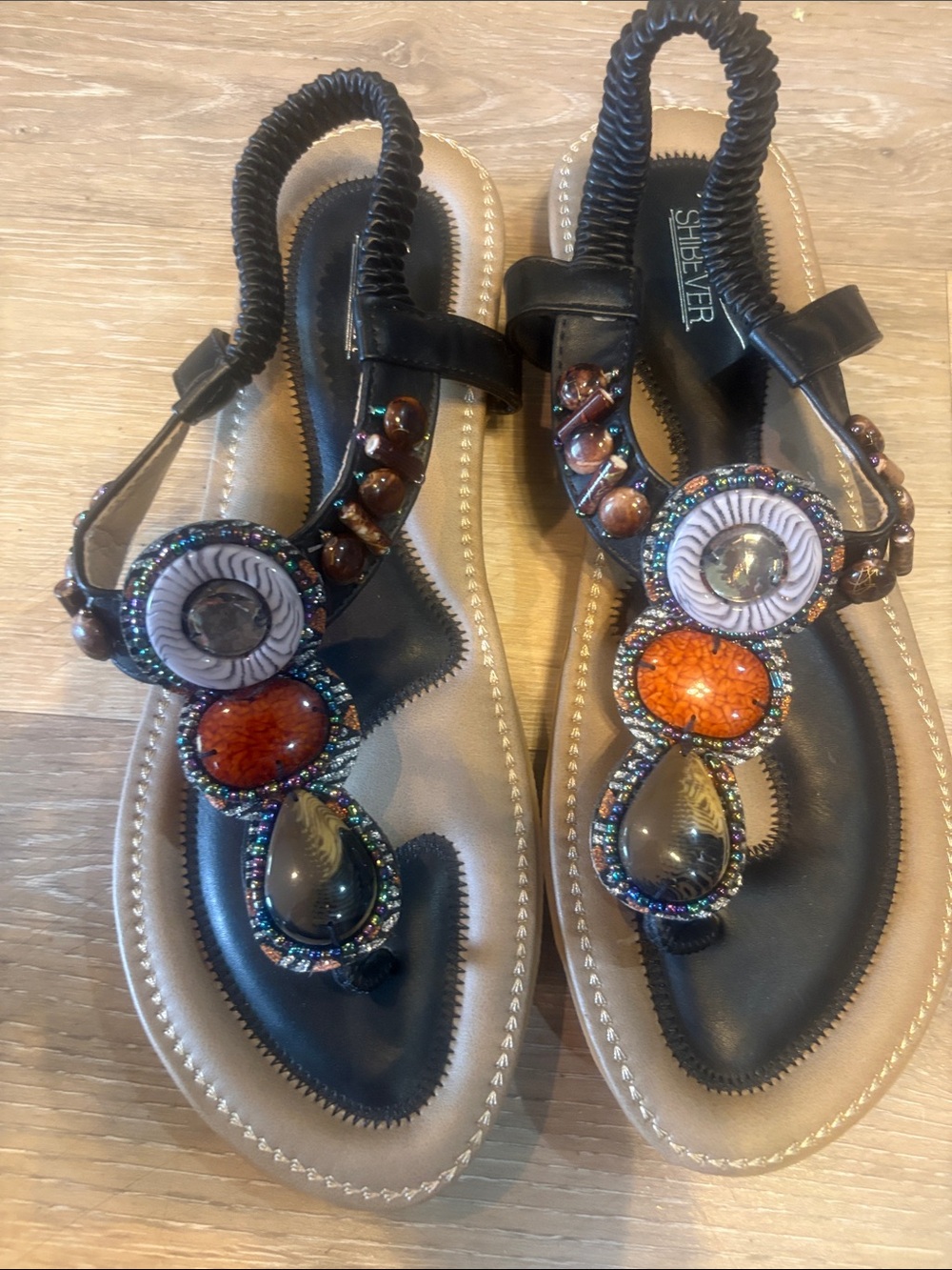Embellished Black T‑Strap Sandals with Orange Accent